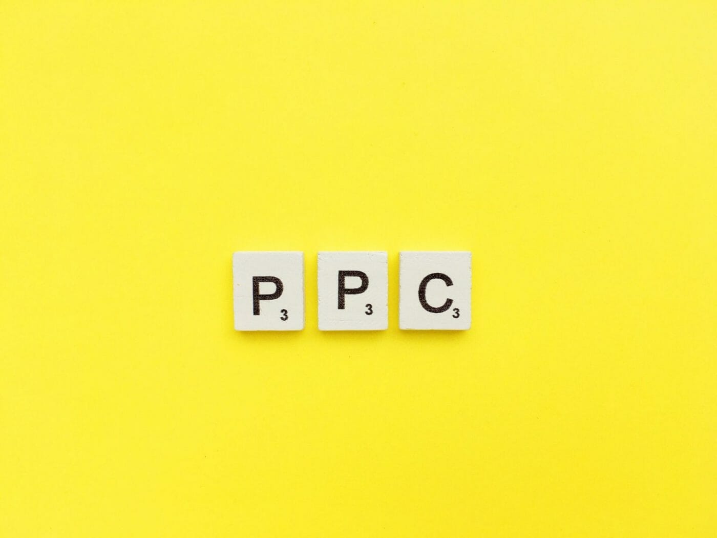 PPC scrabble letters word on a yellow background