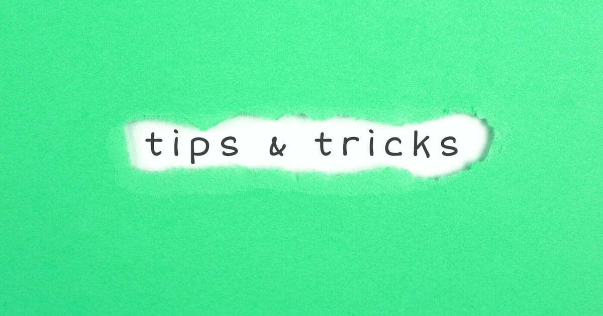 a torn paper written with inscription tops&tricks on a green background