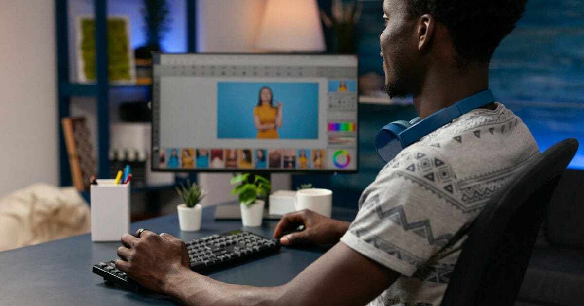 African american photographer editing image using pictures retouching
