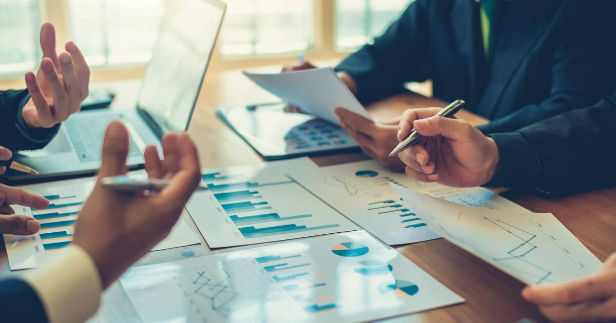 Businessmen are brainstorming for business investment strategies, charts