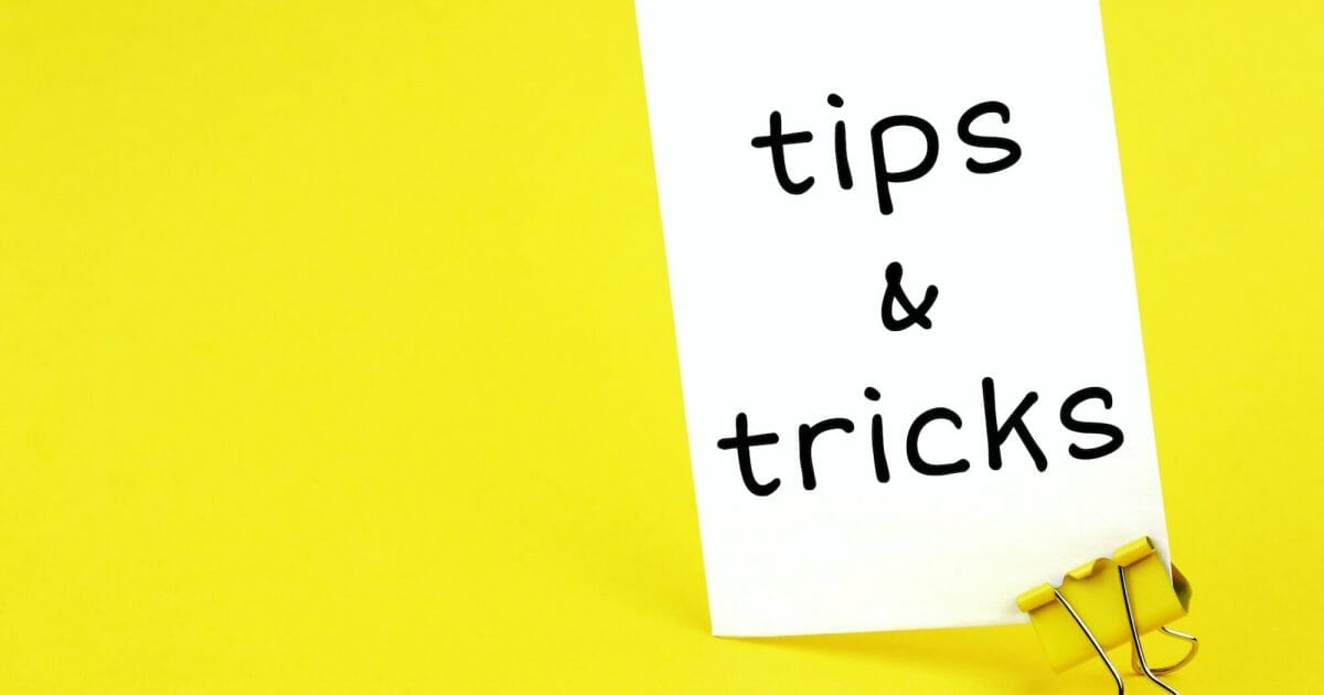 tips & tricks. Note written on a white sticker with paper clip.