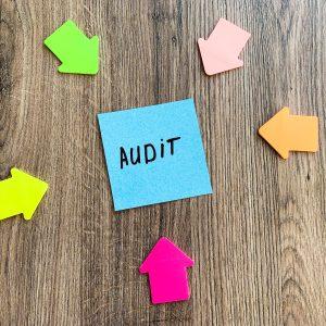 Paper stick with words audit on desk