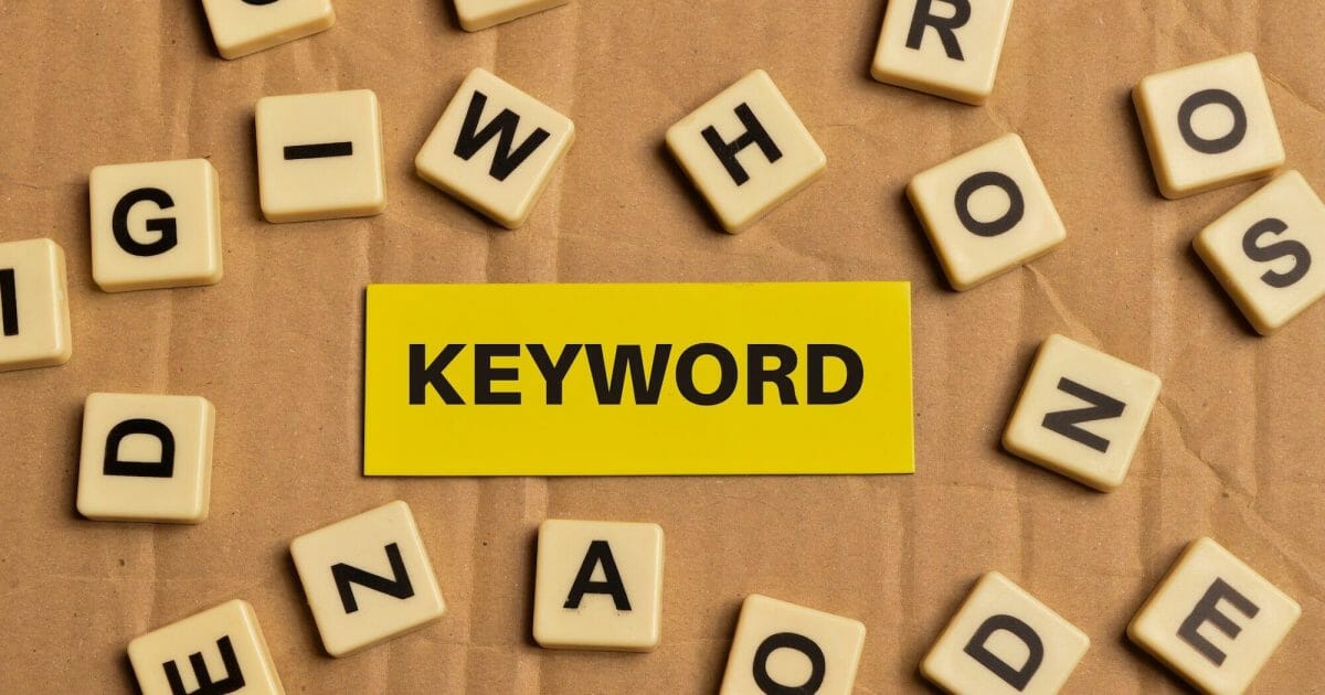 Top view alphabet letters and memo note written with KEYWORD.