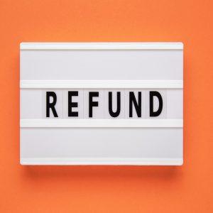 Lightbox with word refund on orange background. Business concept